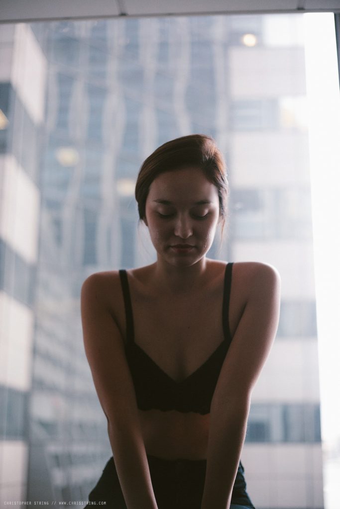 French - Asian Woman looks into the Camera