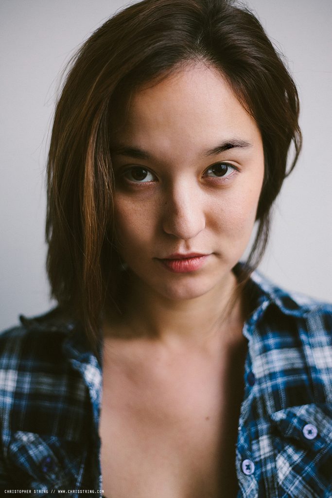 French - Asian Woman looks into the Camera