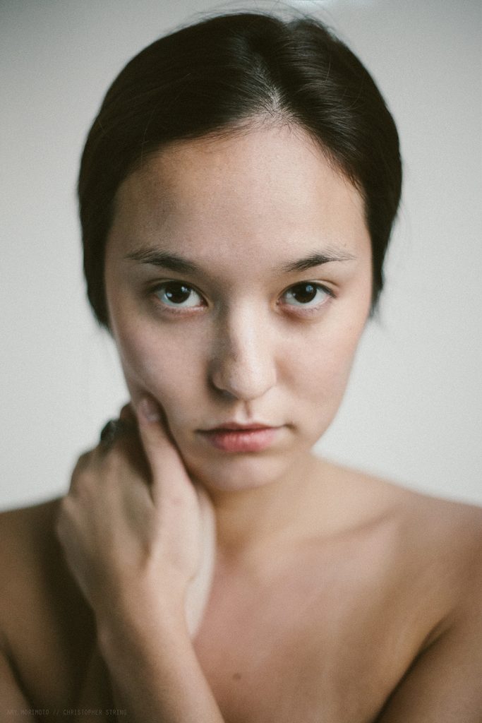 French - Asian Woman looks into the Camera